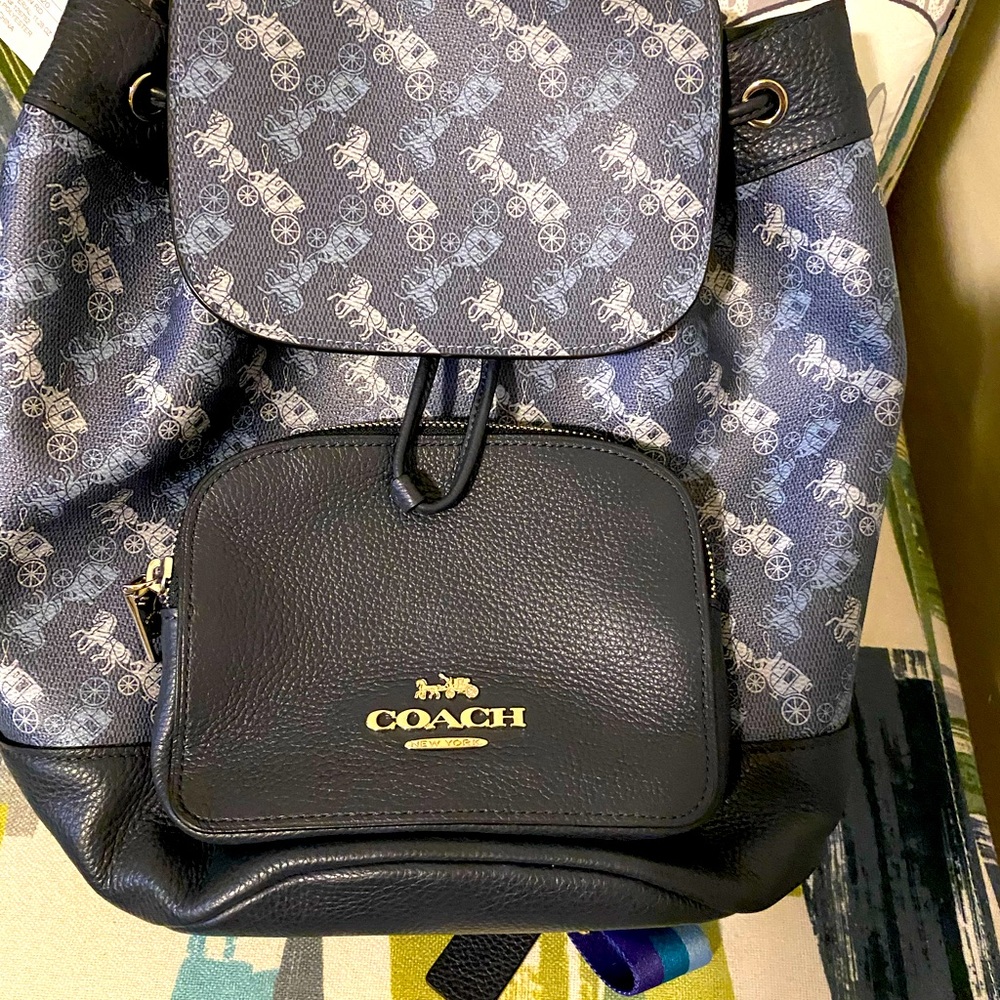 I am selling my coach backpack  it’s dark blue and gray